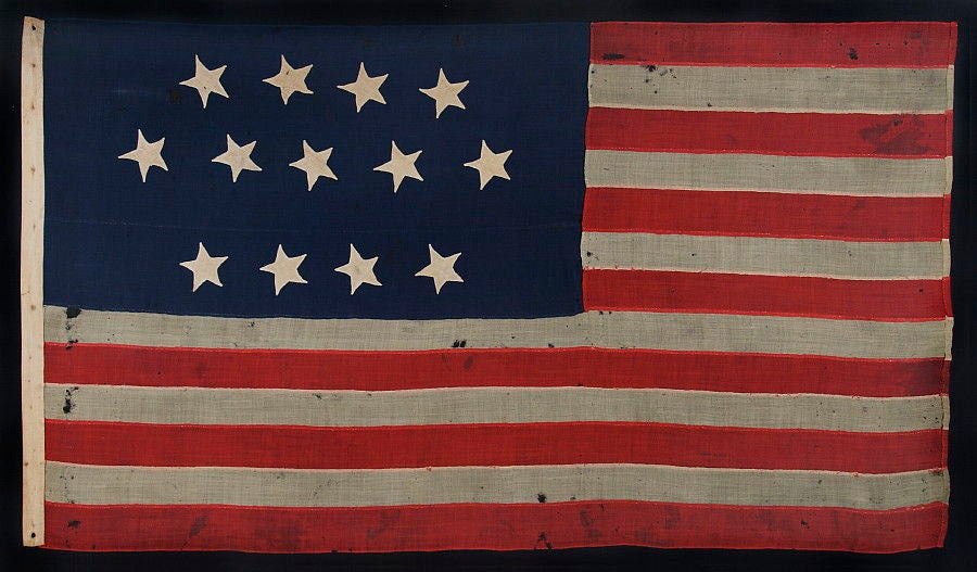 ENTIRELY HAND-SEWN, 13 STAR, U.S. NAVY SMALL BOAT ENSIGN WITH A 4-5-4 CONFIGURATION OF SINGLE-APPLIQUÉD STARS, MADE SOMETIME BETWEEN 1850 AND THE OPENING YEARS OF THE CIVIL WAR (1861-63):<br />
<br />
Entirely hand-sewn, 13 star American national