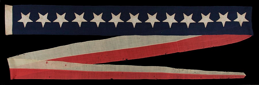 13 STAR US NAVY COMMISSIONING PENNANT, 1876 ERA, A RARE AND BEAUTIFUL EXAMPLE WITH HAND-SEWN STARS:<br />
<br />
Commissioning pennants are the distinguishing mark of a commissioned U.S. Navy ship. A ship became commissioned when this pennant was