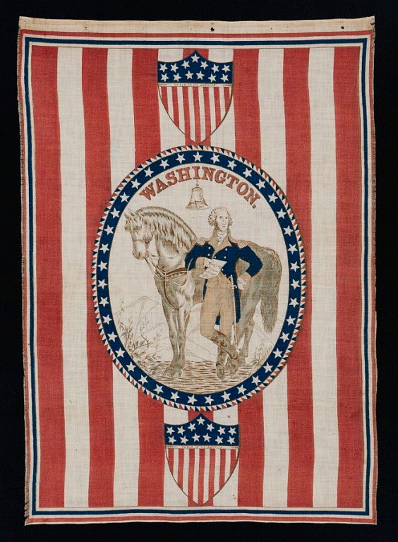 1876 CENTENNIAL CELEBRATION PARADE BANNER WITH OVAL STANDING PORTRAIT OF GEORGE WASHINGTON AND HIS HORSE ON A GROUND OF RED & WHITE STRIPES:

Despite its vertical format, this striking banner, printed on cotton, was intended to be tacked to a