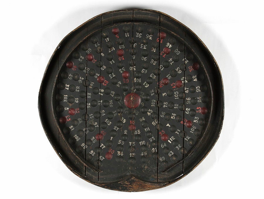 Roulette variation, game of chance, paint-decorated game board in an impressive size with a bold visual design. The form is one that I have never seen before and has great modern presence despite its primitive nature. Square nail construction and