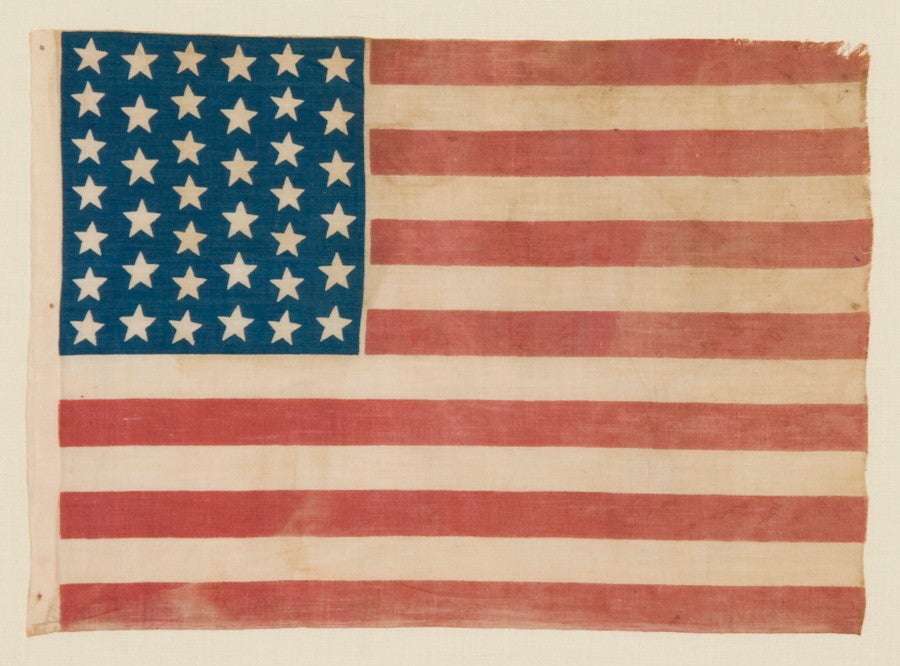 39 STARS IN TWO SIZES, ALTERNATING FROM ONE COLUMN TO THE NEXT, NEVER AN OFFICIAL STAR COUNT, 1875-76:

39 star American parade flag, printed on cotton bunting. This is one of only three basic styles known that use stars in two different sizes to
