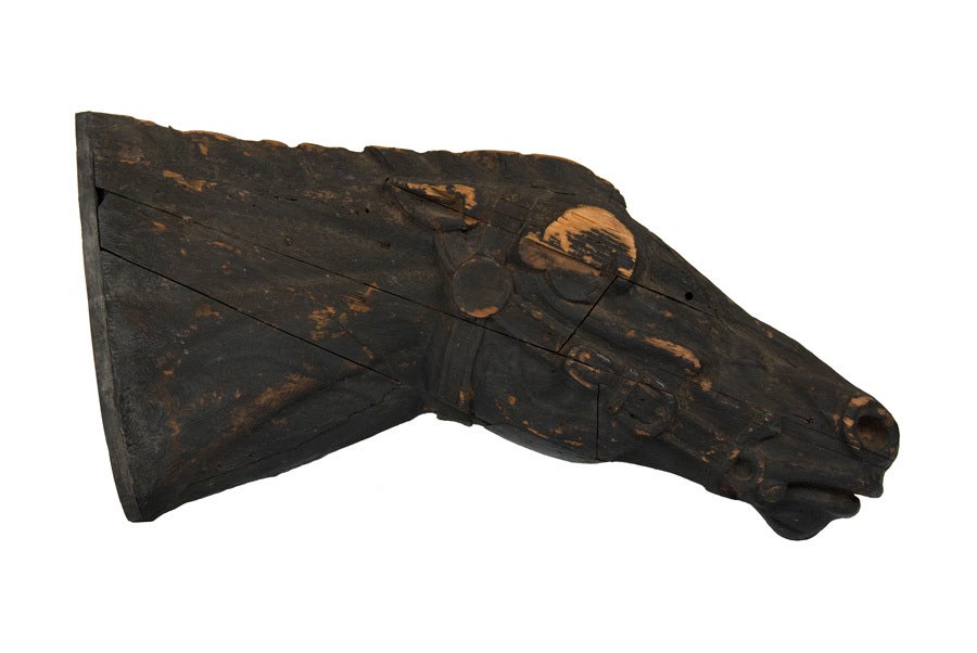 An exceptional, painted American trade sign made from carved wood in the full-bodied form of a race horse’s head. Wonderful movement, tremendous folk character and great early paint surface. Found in San Francisco, this carving probably marked a