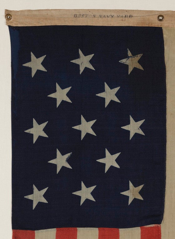 13 STAR U.S. NAVY SMALL BOAT ENSIGN WITH AN EXTREMELY RARE BLOCK-PRINTED MARK FROM THE BOSTON NAVY YARD, 1863-1866:

The U.S. Navy flew 13 star flags on small boats throughout the 19th century, particularly the second half. They did so, because at
