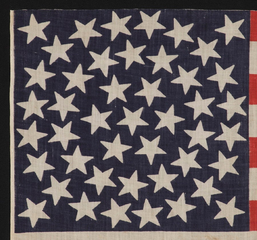 45 STARS IN A MEDALLION CONFIGURATION, A RARE FEATURE IN THIS PERIOD, 1896-1908, UTAH STATEHOOD:

45 star American parade flag, printed on cotton bunting, with a beautiful, triple-wreath style medallion configuration of stars. This highly desired