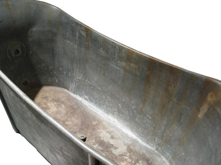 Vintage metal bath tub with some patina and aging.