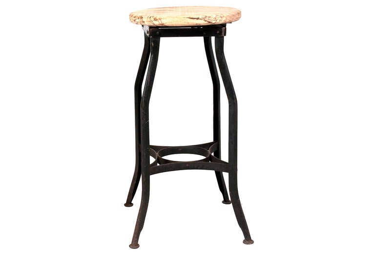 Classic industrial stools with a metal base and a burnt and bleached wood top. All four vary in size. 

Small: 12