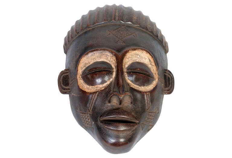 Rare ceremonial tribal mask from the Congo. Made from Iroko Wood with Kaolin pigmentation. It is said to keep death at bay.