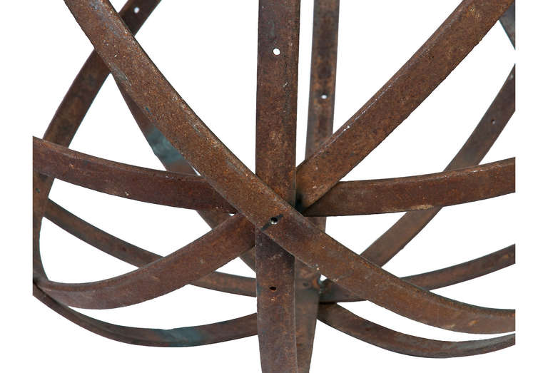 Two large metal decorative spheres made of oxidized steel rings.

Small Sphere: 29