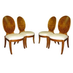 A set of 4 sable finished dining chairs.