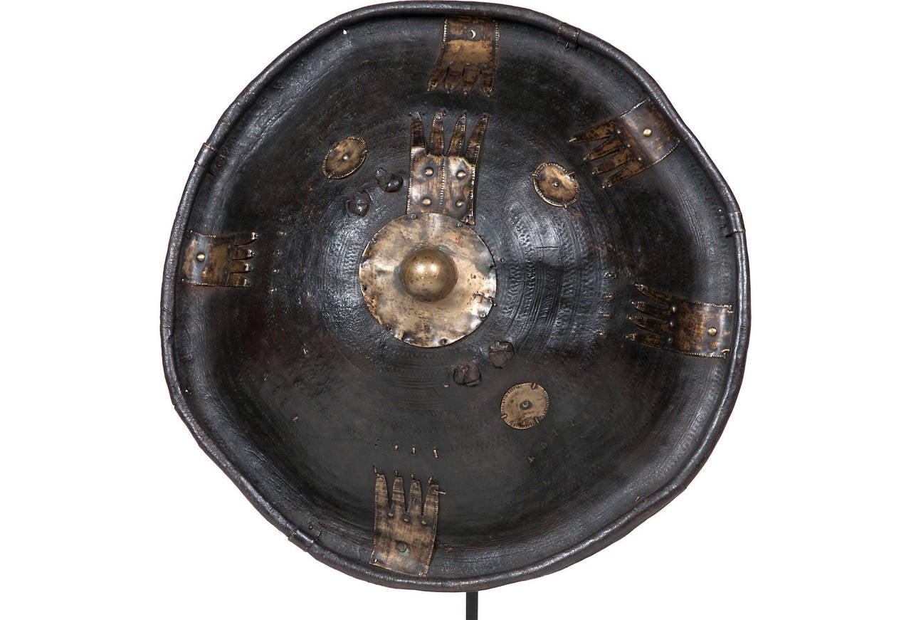 Awarded to the best hunter in the tribe (usually the kings and nobles), this 18th century Ethiopian hunter shield will add a story to any room it is displayed in. 

Thought to be made of Rhino Hide.