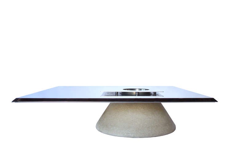This large cocktail table is truly unique. A polished stainless steel top and stone base, featuring a champagne bucket insert.
