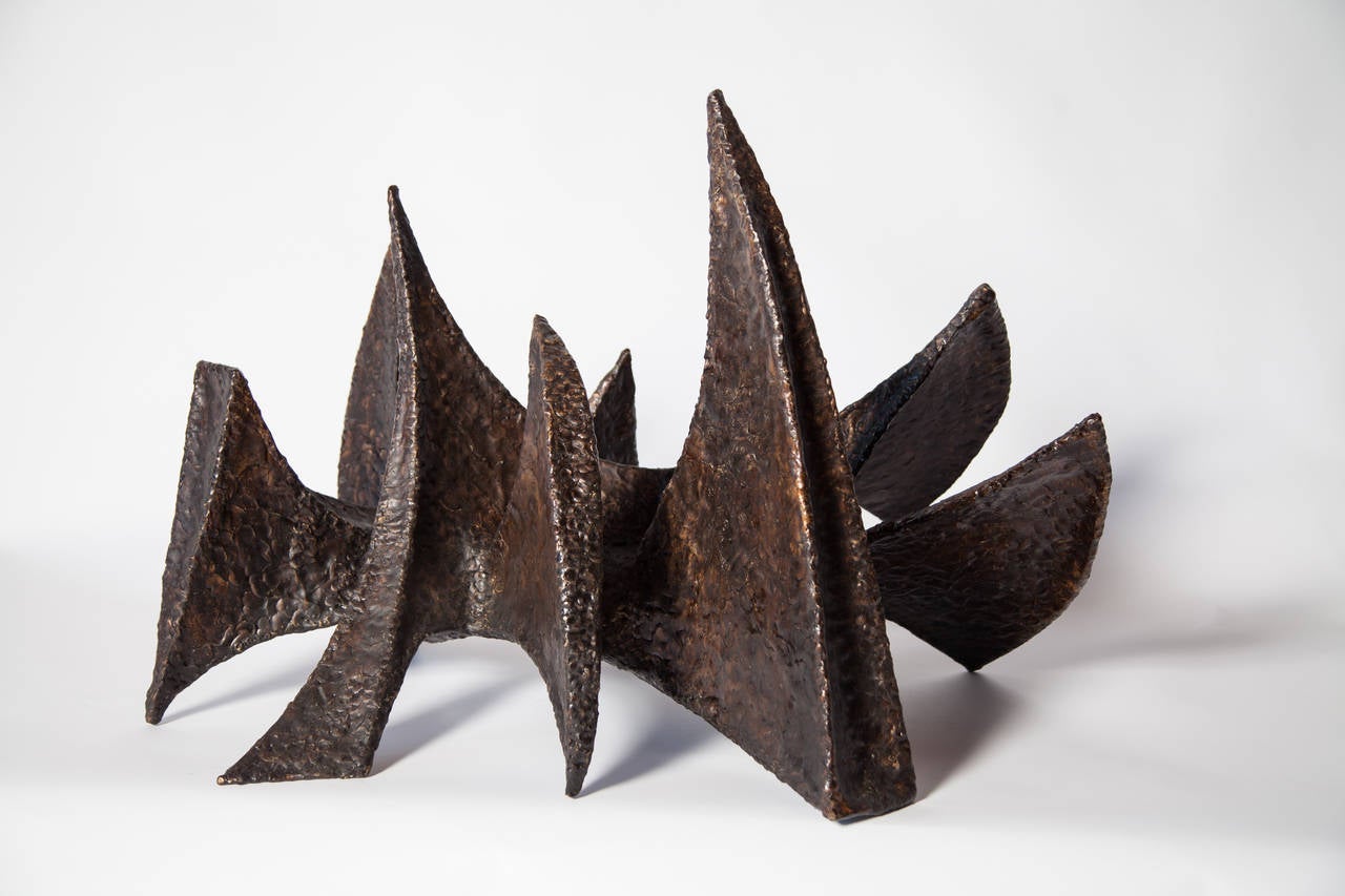 Contemporary bronze sculpture done by New York based Sculptor, BJ Las Ponas. 

To create a piece, Las Ponas cuts sheets of bronze, and shapes them while still hot over an anvil. He melts bronze rods on top, welds them into place and hammers. This
