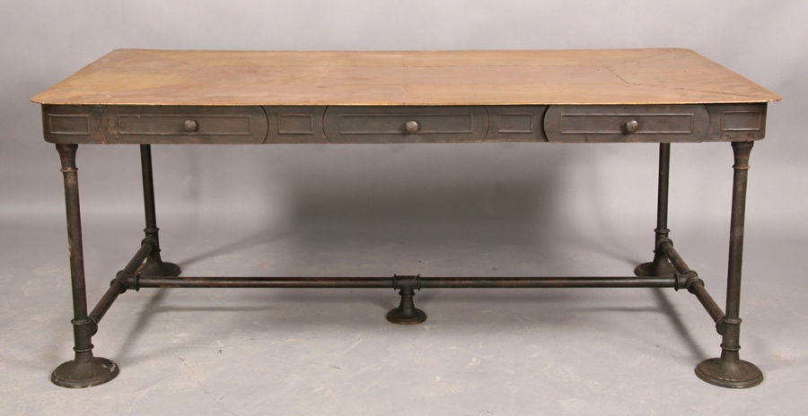Really quite stunning industrial three drawer Partner's desk with a beautiful and unique riveted copper top.