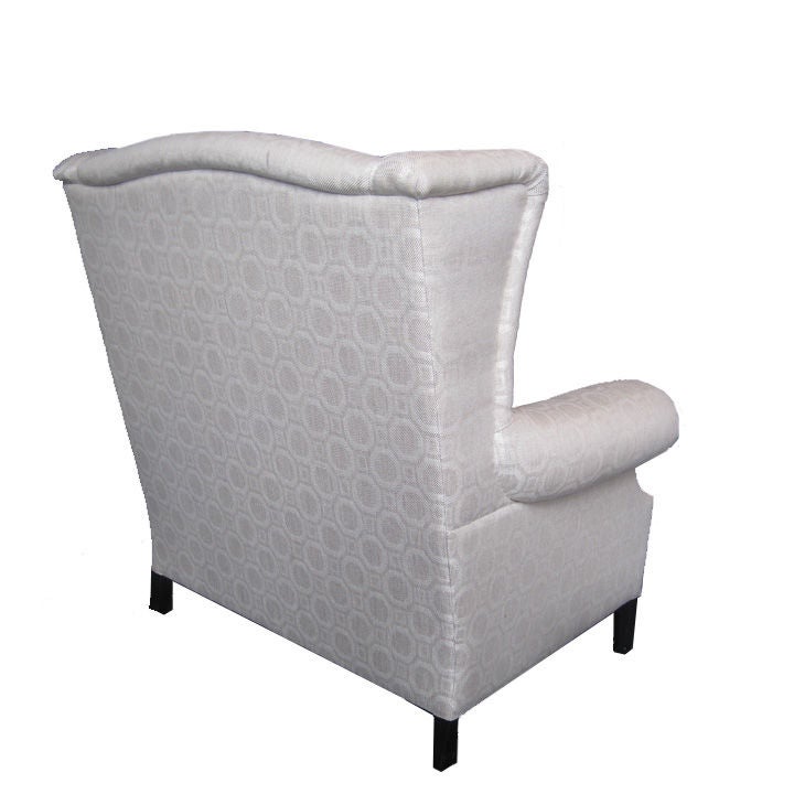 Pair of white and eggshell pattern wing back chairs are newly upholstered. These classic chairs can add elegance to your design with a neutral geometric pattern. Price is per chair