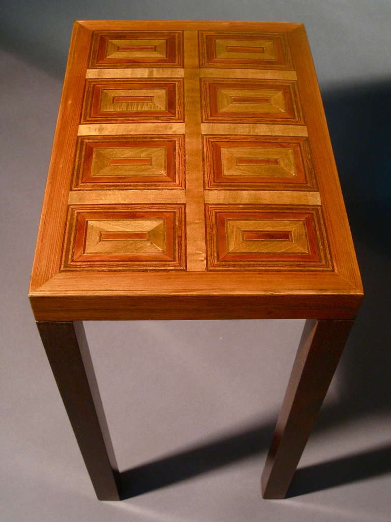 1960s modernist inlaid wood marquetry side table.

WEEKLY DELIVERIES TO MANHATTAN FOR APPROVAL OR SALES. STANDARD DELIVERY FEE IS $150.