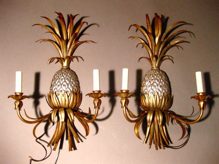 Pair of gilt metal and silver leaf Italian pineapple sconces c.1940s. Although originally candle sconces they have been professionally wired. Still retain 