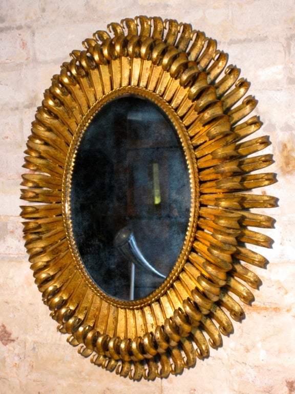 Gilded metal oval eyelash wall mirror c.1960s. Can be hung vertical or horizontal.

WEEKLY DELIVERIES TO MANHATTAN FOR APPROVAL OR SALES. DELIVERY FEE IS $150.