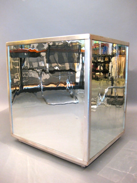 Large mirrored pedestal/table with nickel plated metal corners and five hand-blown mirror panels c.1930s.  Hand-blown mirror creates interesting, slightly distorted reflections.

WEEKLY DELIVERIES TO MANHATTAN FOR APPROVAL OR SALES. DELIVERY FEE