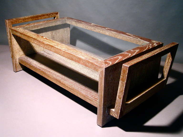 Architectural coffee table in cerused oak with inset glass top designed by James Mont c.1940s.  Engraved script signature underneath. Re-finished. Retains original glass. Height of coffee table surface is 16.25