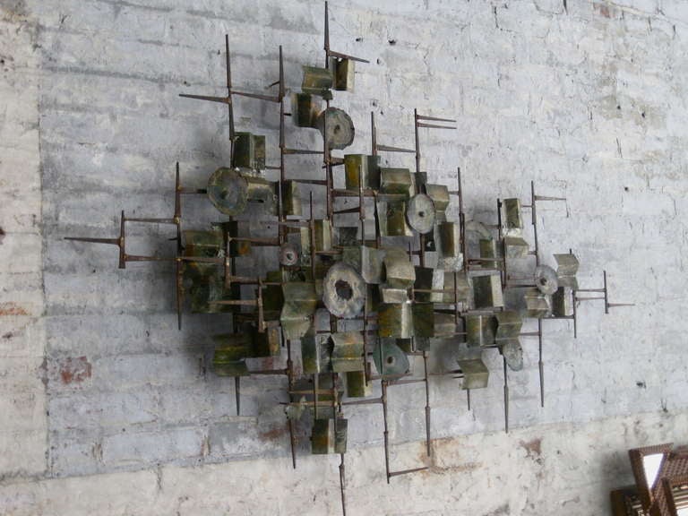 Torch-cut and patinated metal wall sculpture attributed to William Bowie c.1960.

WEEKLY DELIVERIES TO MANHATTAN FOR APPROVAL OR SALES. STANDARD DELIVERY FEE IS $150.