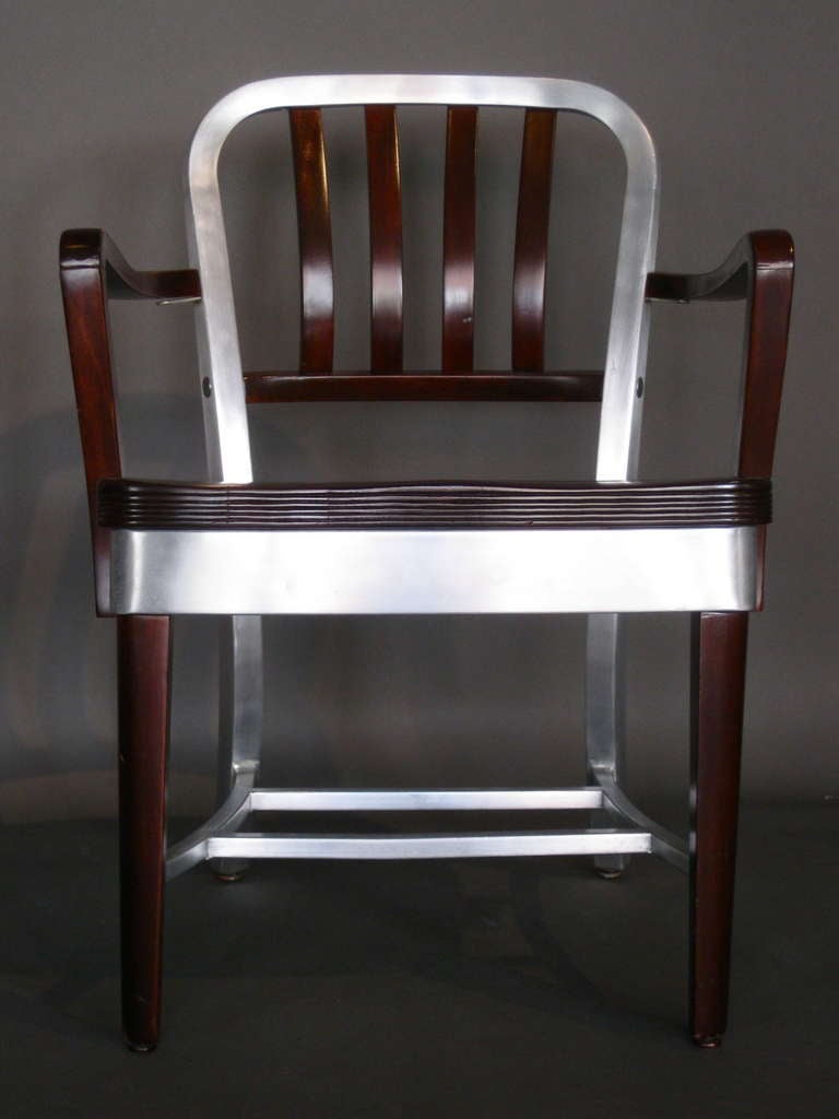 Inventive design American office armchair with wooden front legs and aluminum back legs and frame with aluminum accents mfg. by Shaw Walker c.1950s.

WEEKLY DELIVERIES TO MANHATTAN FOR APPROVAL OR SALES. STANDARD DELIVERY FEE IS $150.