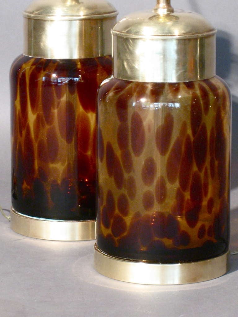 Pair of Italian hand-blown glass faux tortoise shell table lamps with solid brass bases and caps made in Italy c.1960s. Height of bases to top of brass caps is 12