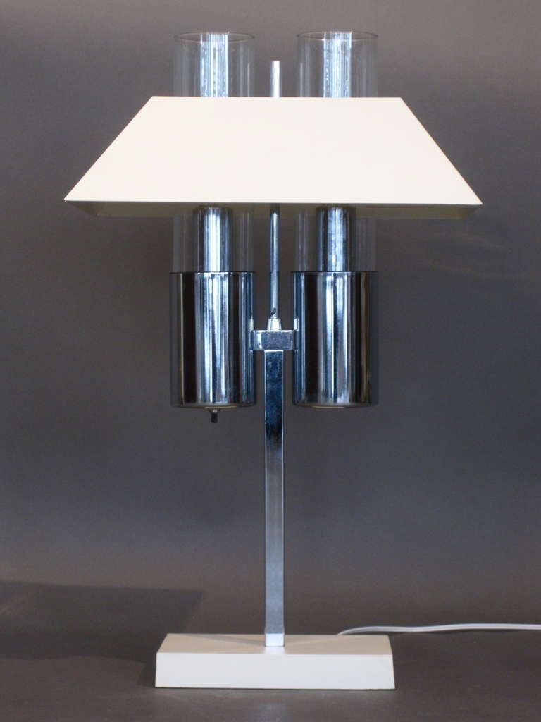 Rarely seen architectural two-light desk lamp with painted metal shade and base, two glass cylinder diffusers and chromed steel shaft mfg. by Raymor c.1960s. Retains Raymor sticker.

WEEKLY DELIVERIES TO MANHATTAN FOR APPROVAL OR SALES. STANDARD