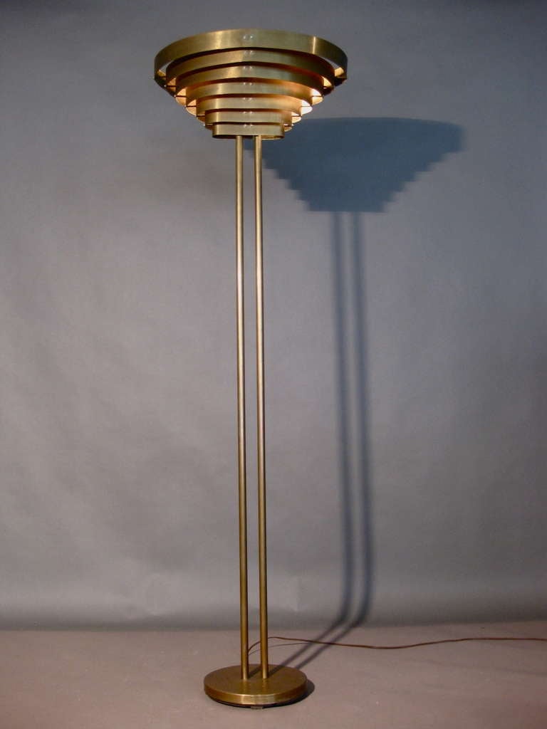 Solid Brass louvered floor lamp with double brass stem designed by Kurt Versen c.1930s. Original patina on brass.

Weekly deliveries to Manhattan for approval or sales. Standard delivery fee is $150.