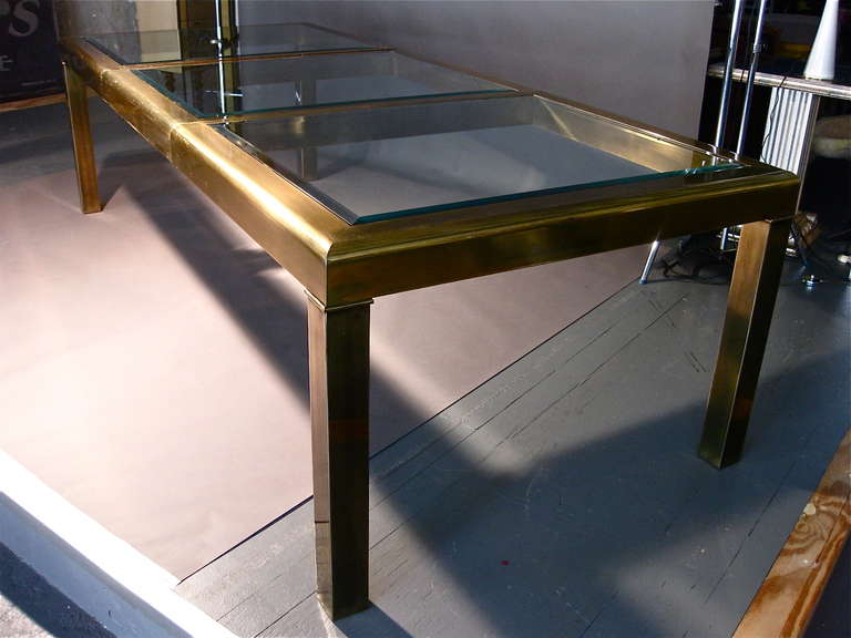 Monumental brass parsons style dining table with inset, beveled glass and one removable 34