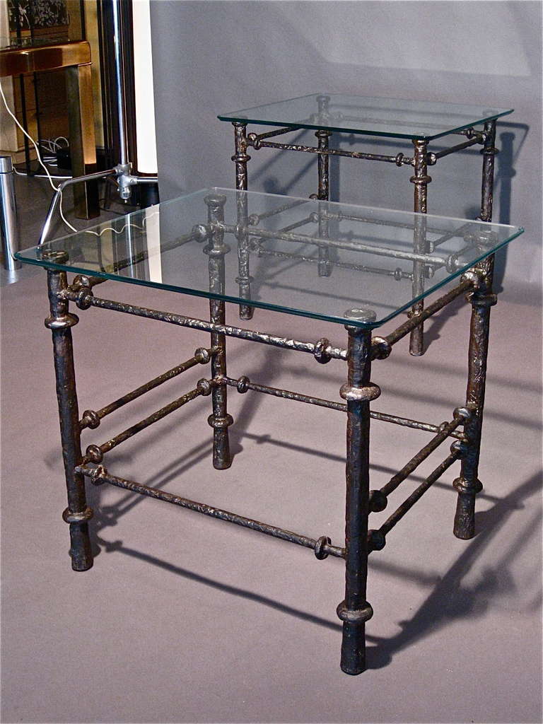Pair of cast iron side tables with the original beveled and molded glass tops with rounded corners in the style of Diego Giacometti c.1970s.

WEEKLY DELIVERIES TO MANHATTAN FOR APPROVAL OR SALES. STANDARD DELIVERY FEE IS $150.