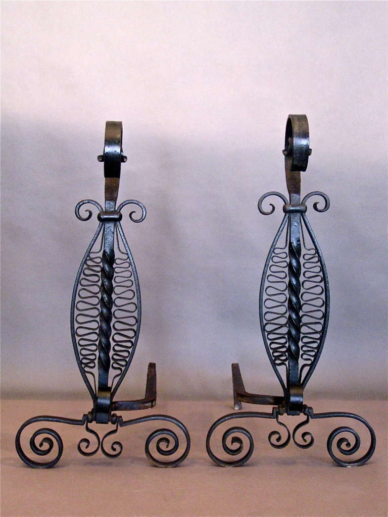 Pair of tall wrought iron andirons c.1920s.

WEEKLY DELIVERIES TO MANHATTAN FOR APPROVAL OR SALES. STANDARD DELIVERY FEE IS $150.