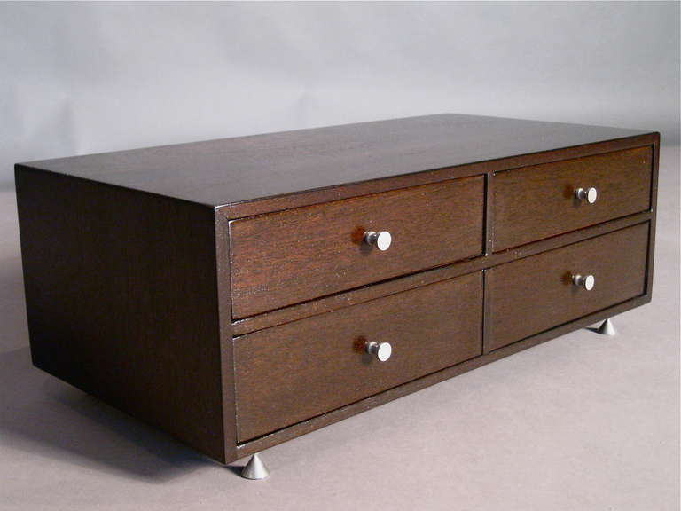 Mahogany three drawer jewelry chest with satin finish chromed metal hardware and feet in the style of Paul McCobb c.1950s.

WEEKLY DELIVERIES TO MANHATTAN FOR APPROVAL OR SALES. STANDARD DELIVERY FEE IS $150.