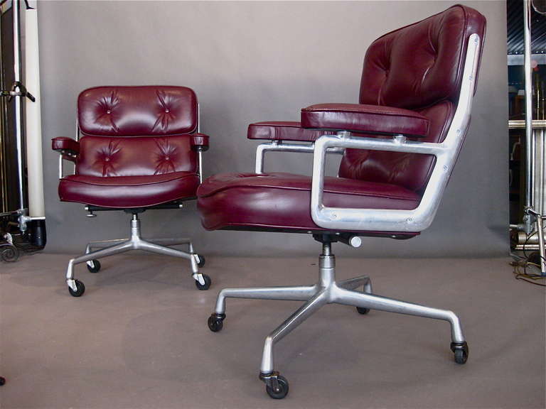 Desk chair with cast aluminum frame on casters and original cordovan colored leather designed by Charles Eames for the executive offices in the Time-Life building in New York City in 1960 and produced by Herman Miller. Beautiful patina on original