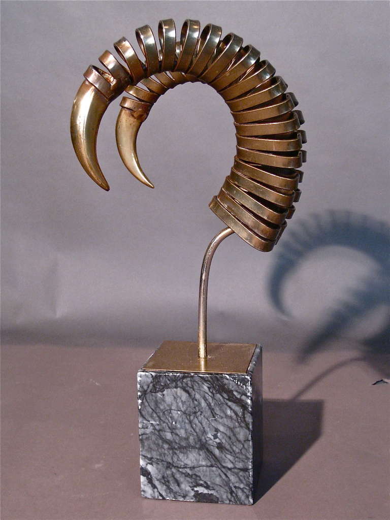 Metal antelope sculpture with brass finish mounted on original marble base by Curtis Jere c.1970s. Signed.

WEEKLY DELIVERIES TO MANHATTAN FOR APPROVAL OR SALES. STANDARD DELIVERY FEE IS $150.