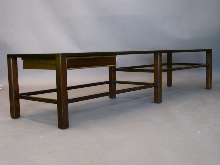 Harvey Probber mahogany bench/coffee table with one drawer underneath trimmed in brass c.1950s. Made for his own firm. Photographed on pg.25 of THE DESIGN BOOK by Harvey Probber.
Refinished.

WEEKLY DELIVERIES TO MANHATTAN FOR APPROVAL OR SALES.