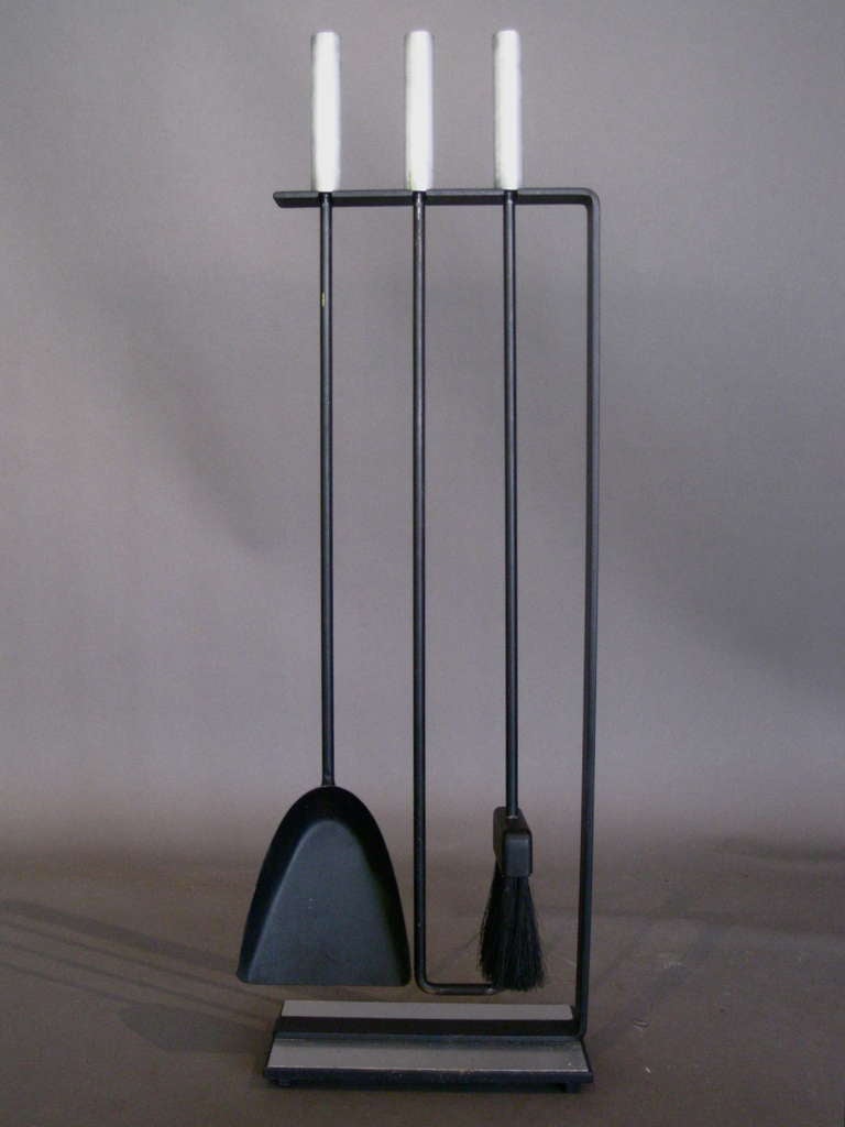 Minimalist wrought iron fire tools set with brushed aluminum handles and base made by Pilgrim c.1950s.  Set includes poker, shovel, broom, and stand.

WEEKLY DELIVERIES TO MANHATTAN FOR APPROVAL OR SALES. DELIVERY FEE IS $150.