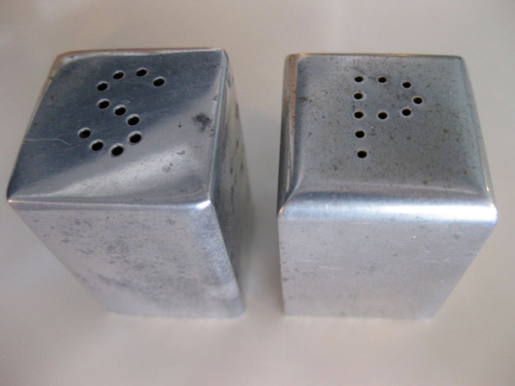 Modernist aluminum salt and pepper shakers designed by iconic American painter and photographer Charles Sheeler in 1935. Included in the exhibition 