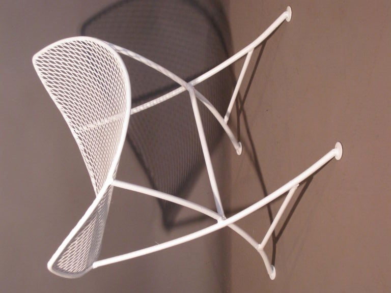 Wrought iron and steel mesh stool by the New York firm Salterini. New white painted finish. Seat height: 15.75