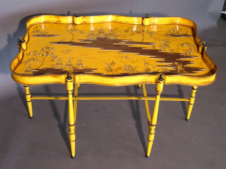 Chippendale chinoiserie metal tray table/coffee table with hand painted oriental scene and folding legs made in Italy c.1950's. Tray is removable for serving.

WEEKLY DELIVERIES TO MANHATTAN FOR APPROVAL OR SALES. DELIVERY FEE IS $150.
