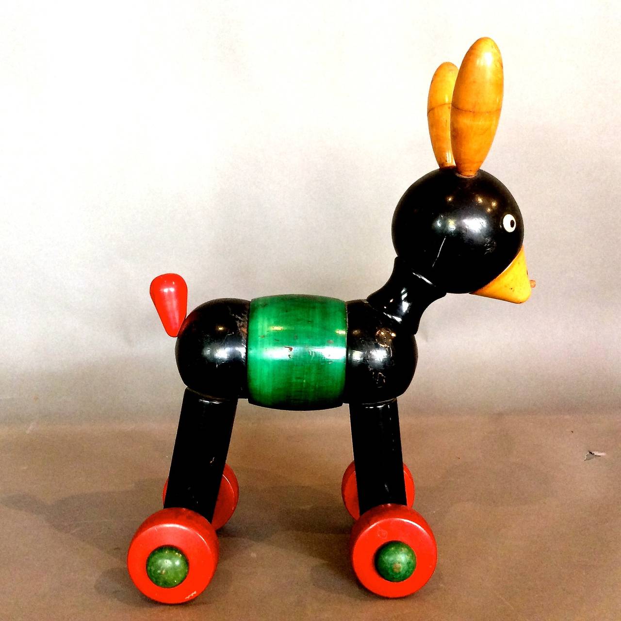 Black lacquered and stained wood articulated pull toy manufactured by the Italian firm Sevi c.1940s in a geometric constructivist style.

WEEKLY DELIVERIES TO MANHATTAN FOR APPROVAL OR SALES. STANDARD DELIVERY FEE IS $150.