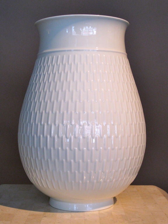 Exceptional large scale white porcelain vase with raised decoration designed by Thorkild Olsen in Denmark for Royal Copenhagen. Mark underneath with line under the 