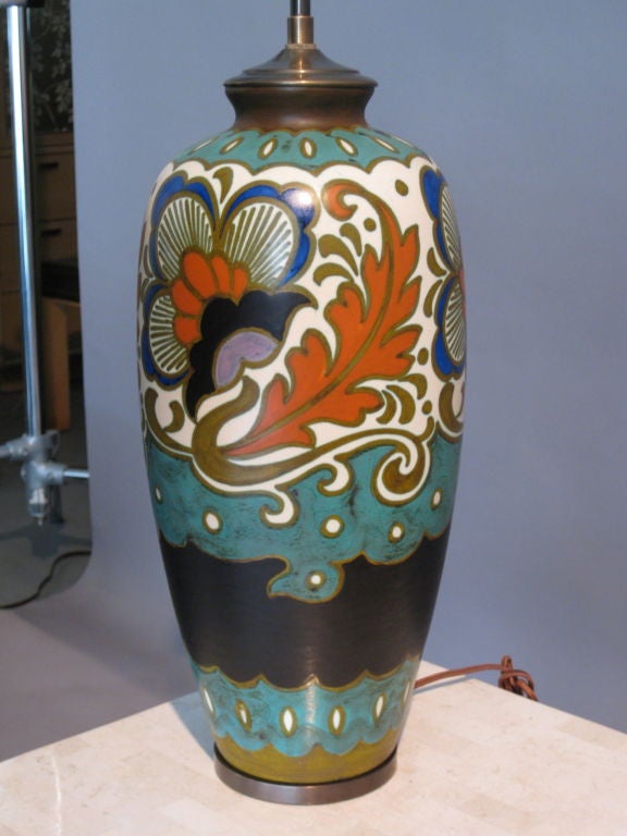 Large and exceptional ceramic lamp with exuberant stylized floral decoration made in Gouda, Netherlands in the Art Nouveau style by the firm Platteelbakkerij Zuid-Holland (PZH) in 1925. Hand painted by Andreus Marinus Rijp. Model #707. Decoration