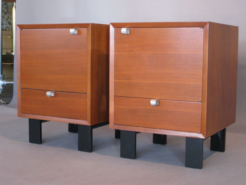 Rare pair of opposing door walnut nightstands/bedside tables each with a closed cabinet space and one drawer designed by George Nelson and Associates in 1948 for Herman Miller.

WEEKLY DELIVERIES TO MANHATTAN FOR APPROVAL OR SALES. DELIVERY FEE IS