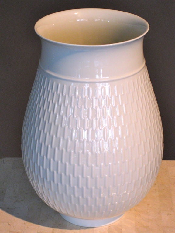 Exceptional large scale white porcelain vase with raised decoration designed by Thorkild Olsen in Denmark for Royal Copenhagen. Mark underneath with line under the 