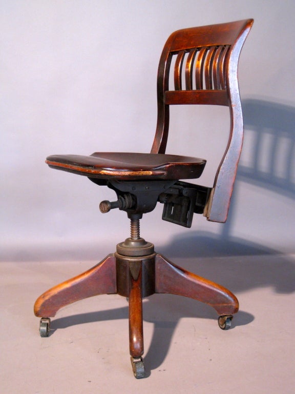 American industrial design adjustable height and swiveling office/desk chair on casters c.1920s mfg. by Clark & Gibby, Inc. of New York.

WEEKLY DELIVERIES TO MANHATTAN FOR APPROVAL OR SALES. DELIVERY FEE IS $150.