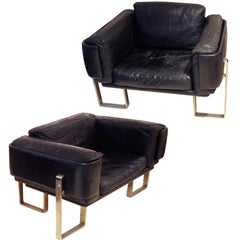 A Pair of Modernist Club Chairs in Aluminum and Leather