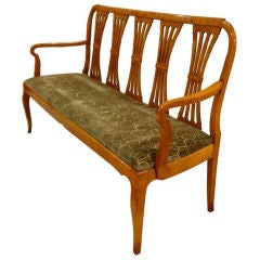 An Antique Armed Bench in Flamed Birch