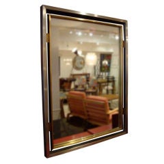 A Steel and Brass Wall Mirror by Guy Lefevre for Jansen