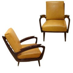 A Pair of Open Armed Club Chairs in Stained Mahogany and Leather