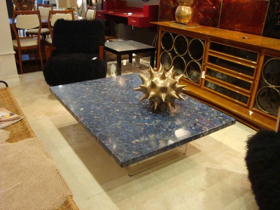 A custom made cocktail table featuring a base in thick lucite onto which sits a rectangular top in deep blue Egyptian marble which has been inlayed in a herringbone pattern using small rectangular pieces of marble. By J.J. Hervy, last quarter of the